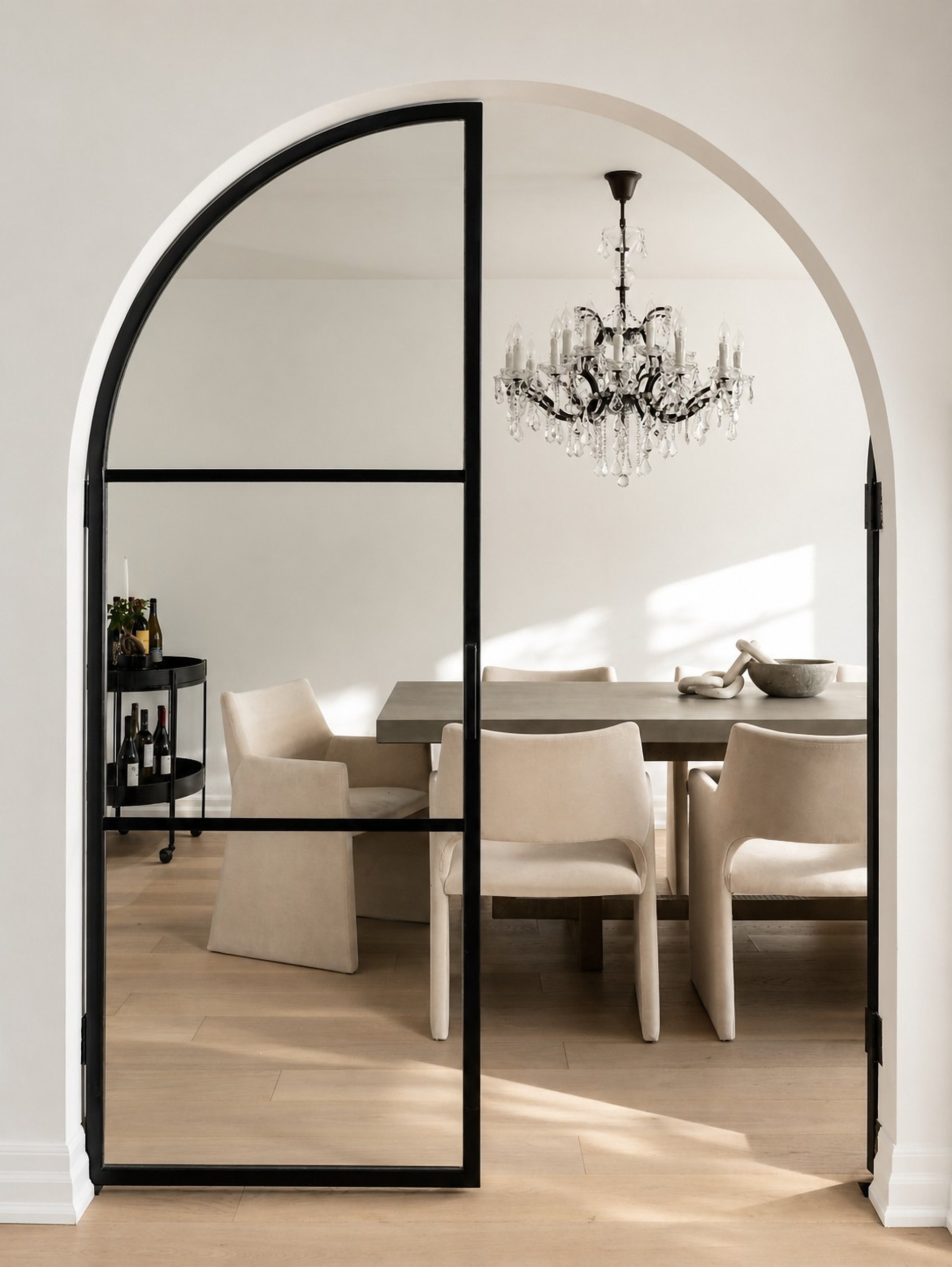 Arched glass door to the dining room — Curvilinear Forms, Greater Toronto Area — interior design by RZ Interiors