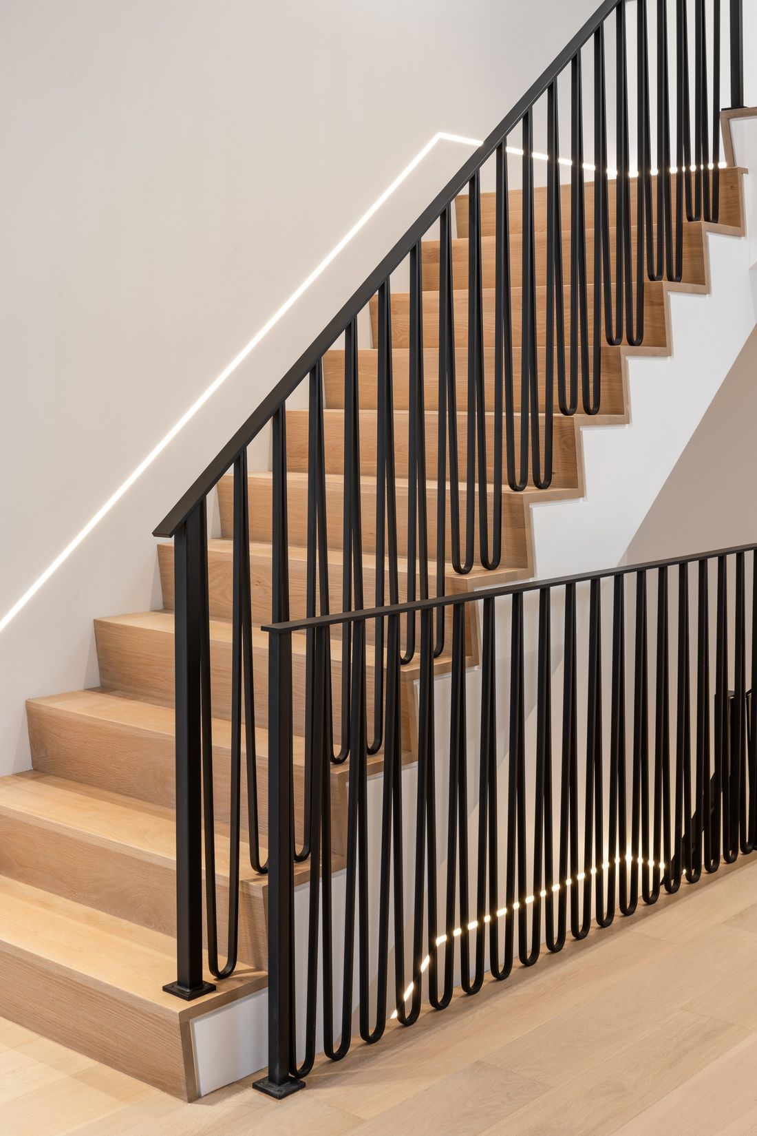 Black picket rail — The Frame, Kleinburg, Vaughan — interior design by RZ Interiors