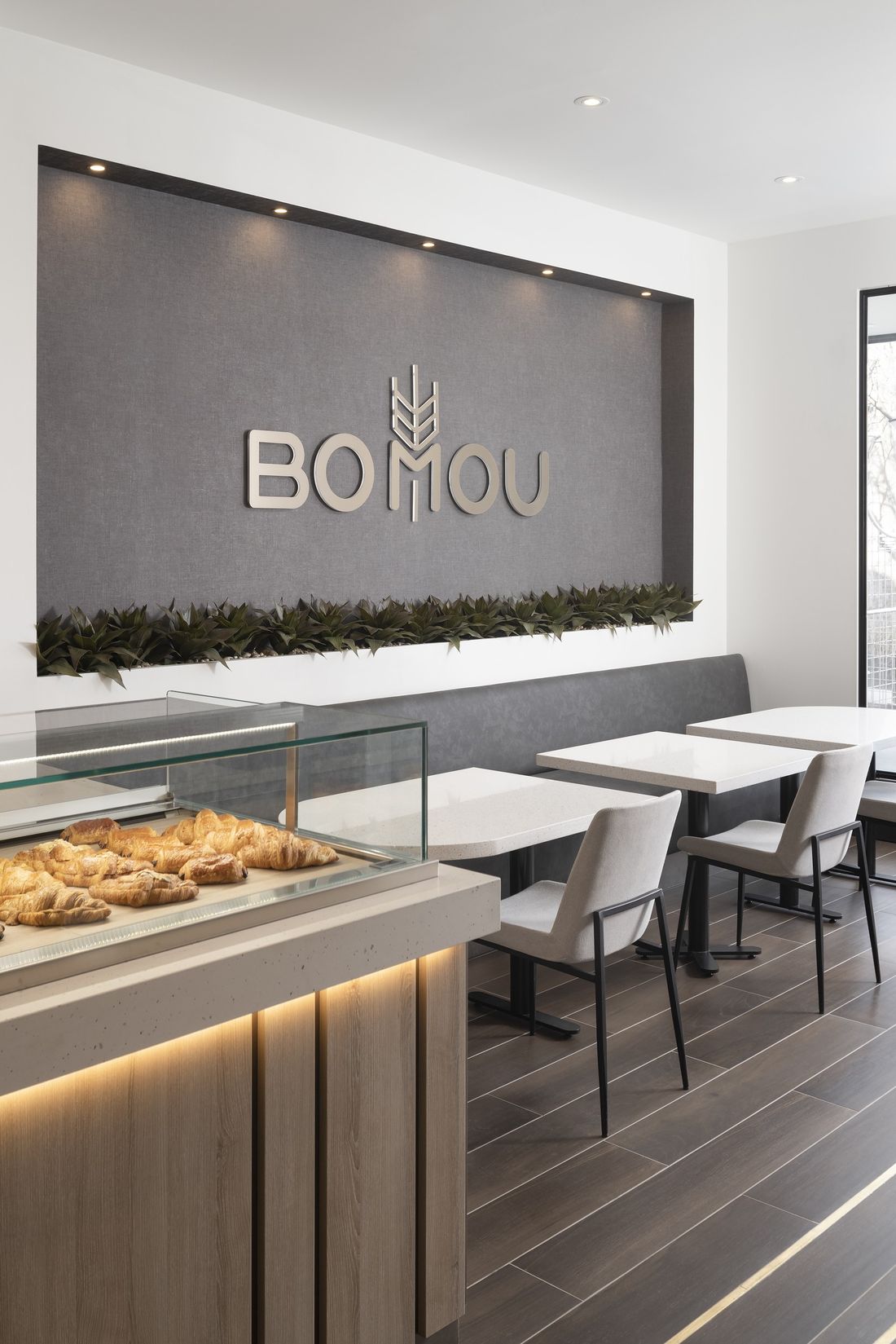 Brand wall and banquette — Bomou on Bayview, East York, Toronto — interior design by RZ Interiors