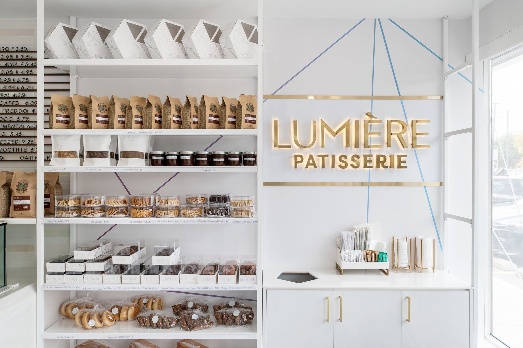Branded bread wall — The Light Bake, North York, Toronto — interior design by RZ Interiors
