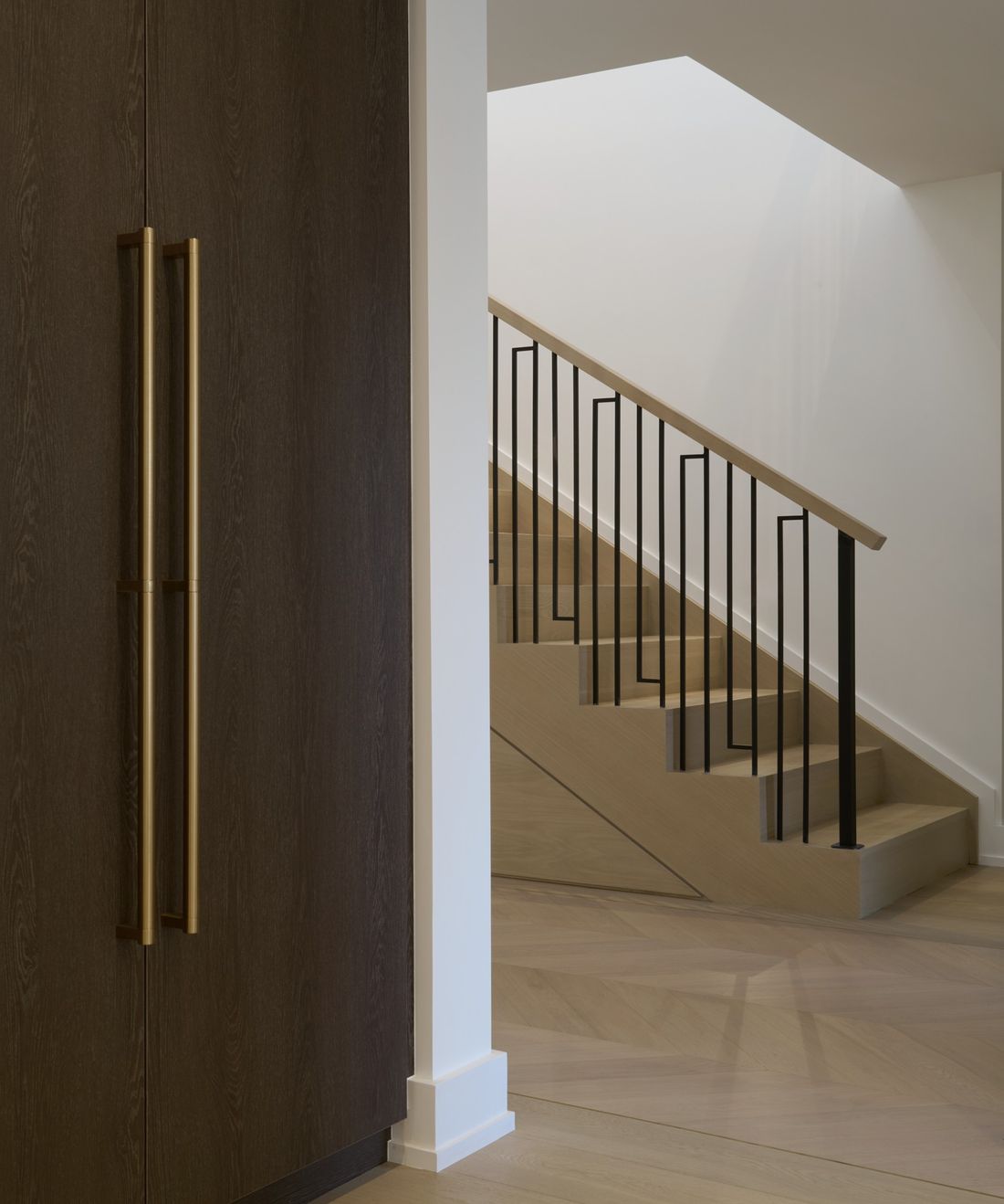 Brass pulls and the stair — The Corner House — interior design by RZ Interiors