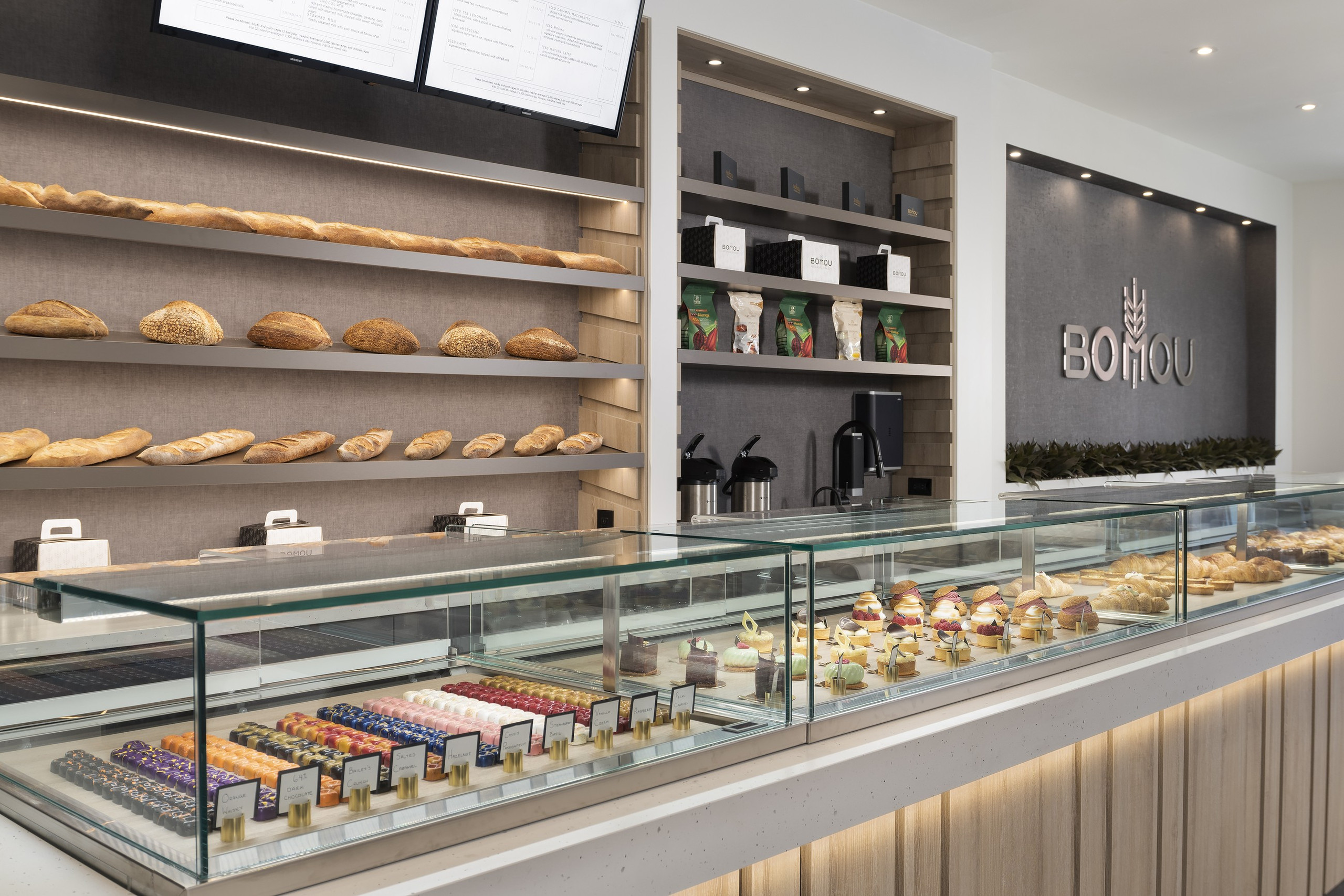 Bread wall and pastry case — Bomou on Bayview, East York, Toronto — interior design by RZ Interiors