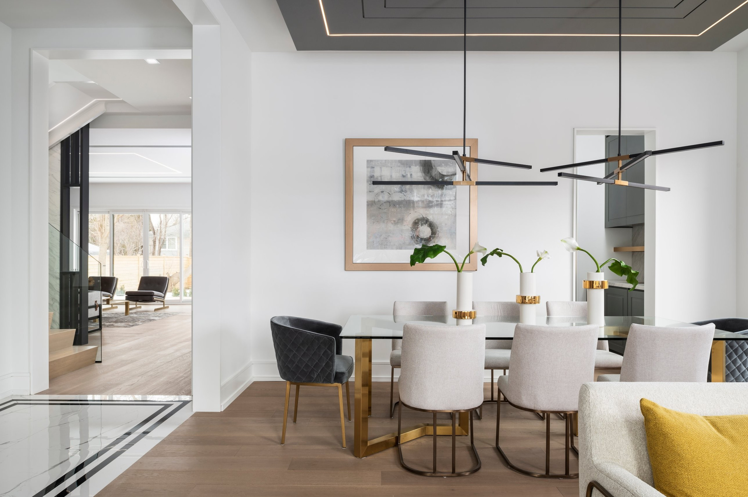 Dining room and lit ceiling — Two Volumes, North York, Toronto — interior design by RZ Interiors