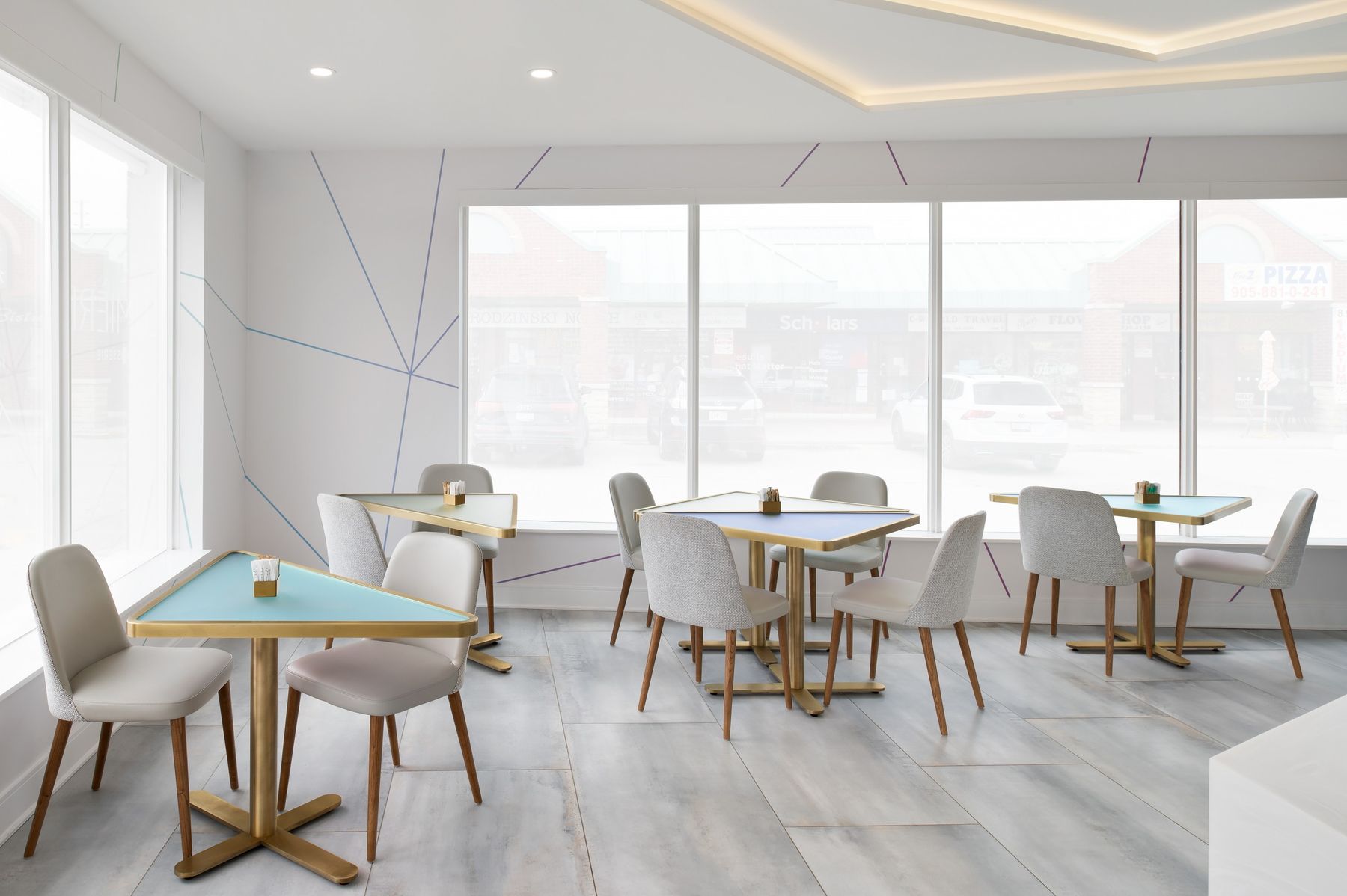 Dining tables and prism lines — The Light Bake, North York, Toronto — interior design by RZ Interiors