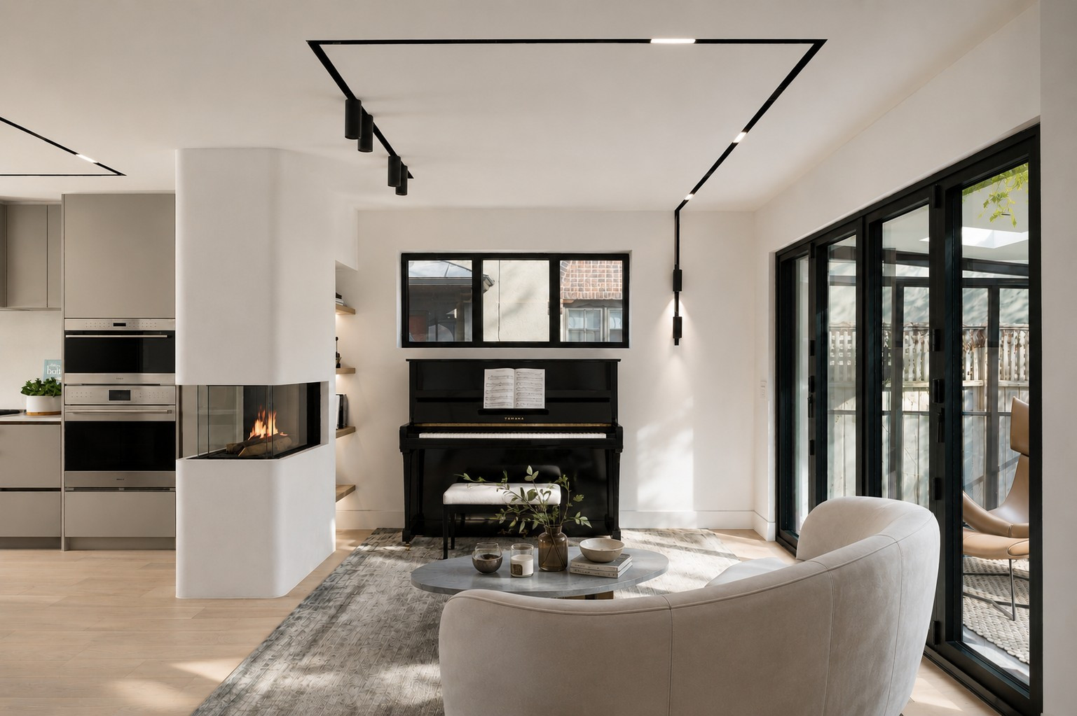 Family room and three-sided corner fireplace — The Open House, Moore Park, Toronto — interior design by RZ Interiors