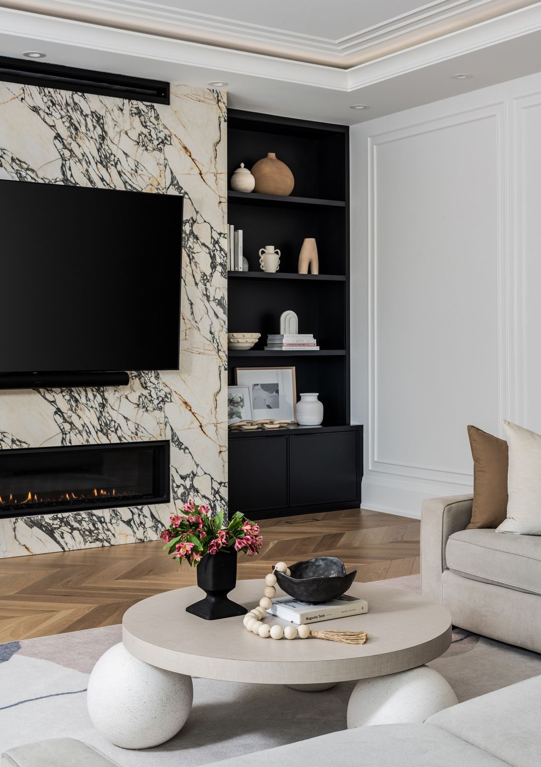 Fireplace wall and black built-ins — The Gathering House, Kleinburg, Vaughan — interior design by RZ Interiors