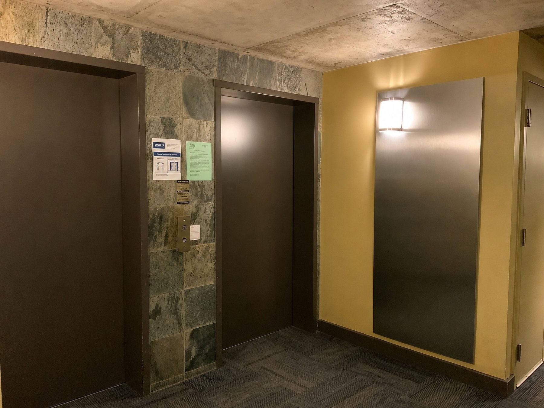 Garage elevator lobby, before — The Mezzanine Lofts, King West, Toronto — interior design by RZ Interiors