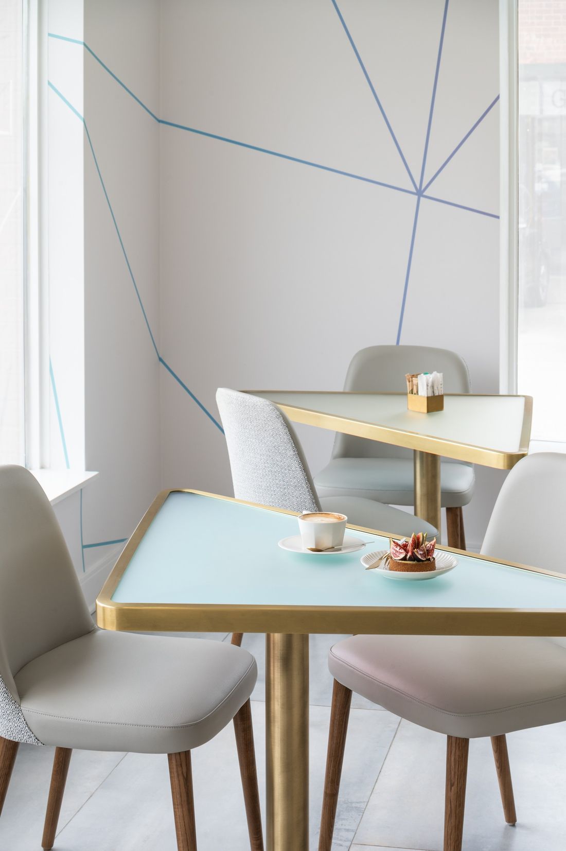 Gold-edged dichroic table — The Light Bake, North York, Toronto — interior design by RZ Interiors