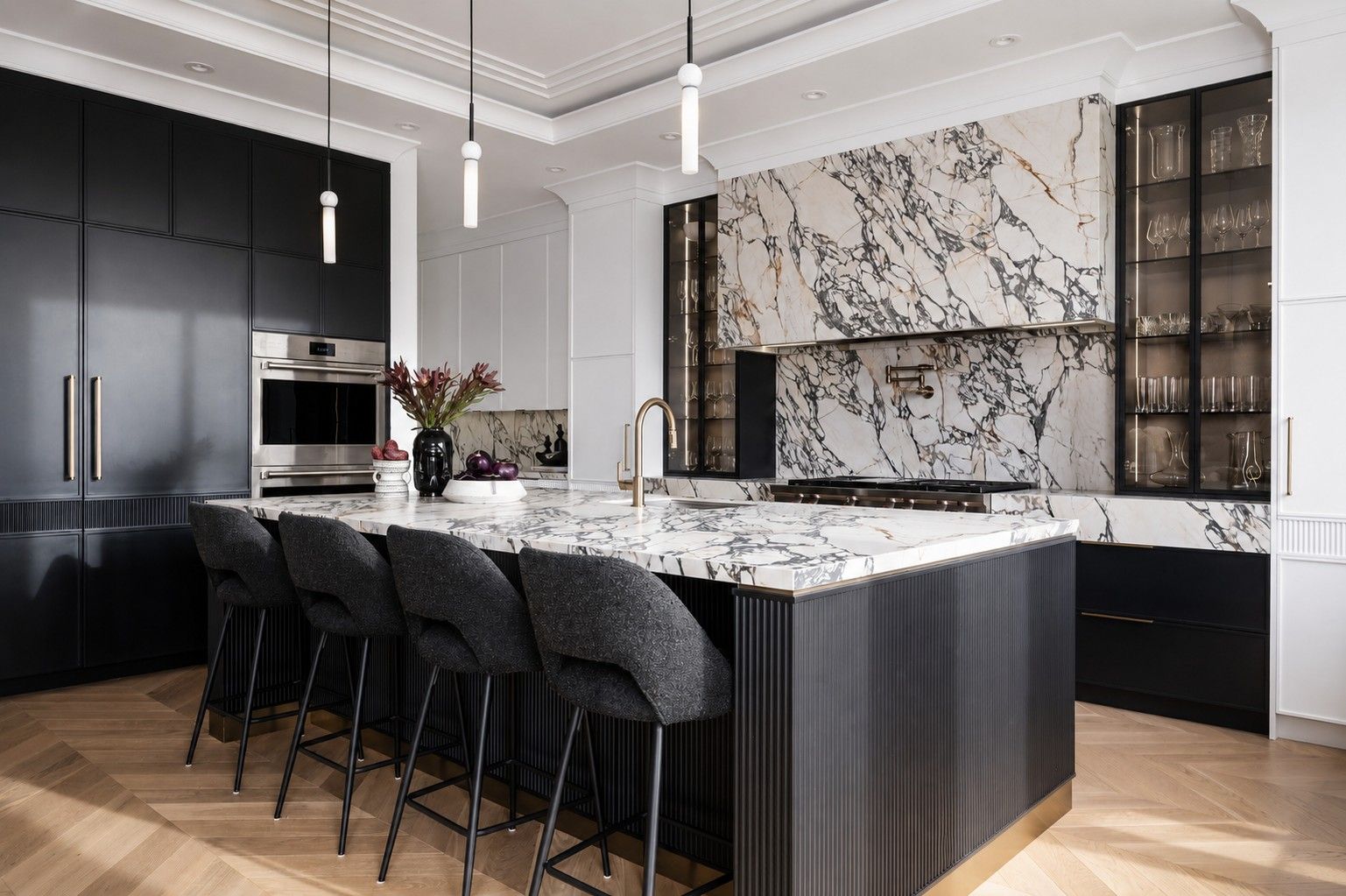 Kitchen, black cabinetry and ribbed island — The Gathering House, Kleinburg, Vaughan — interior design by RZ Interiors