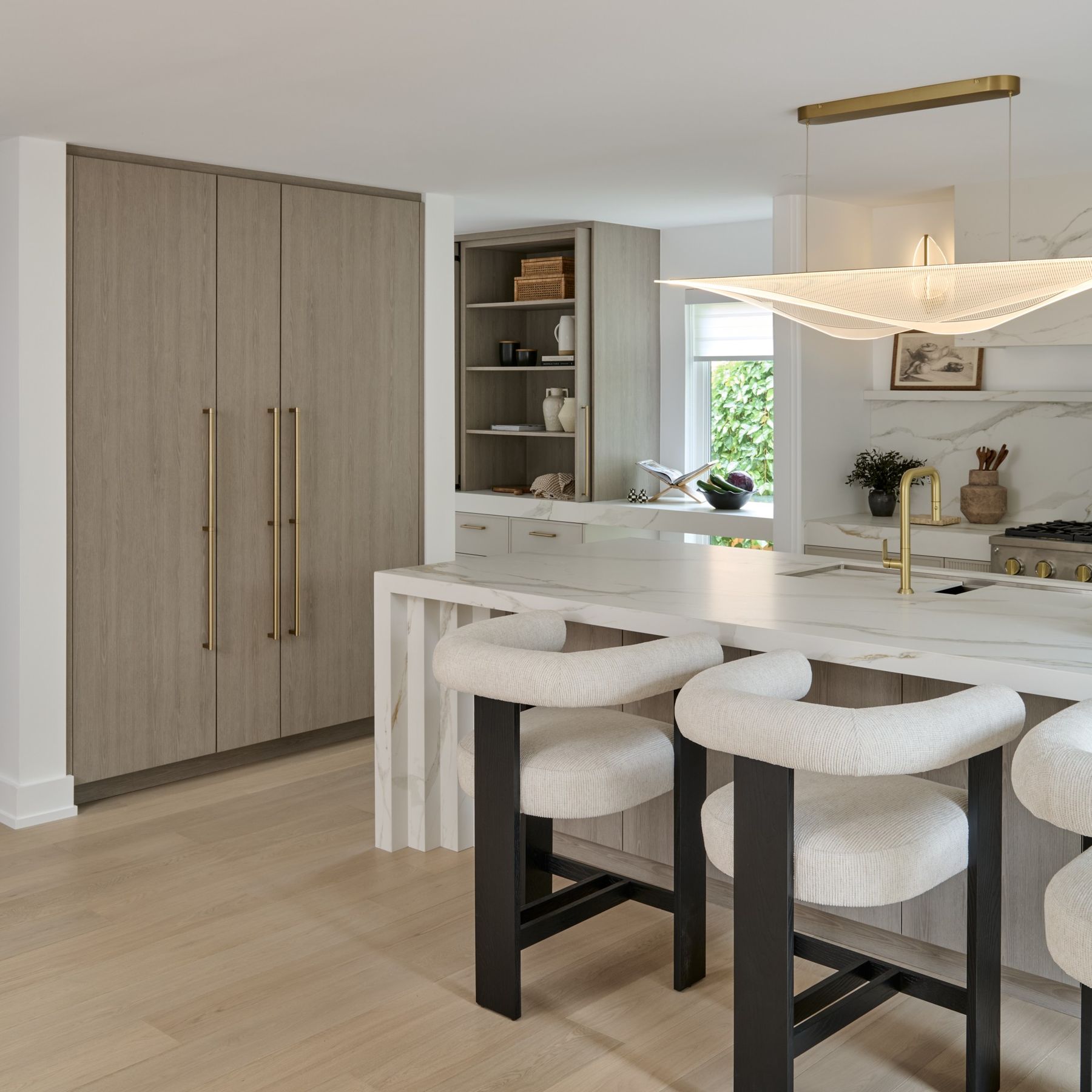 Kitchen island and floating pendant — The Corner House — interior design by RZ Interiors