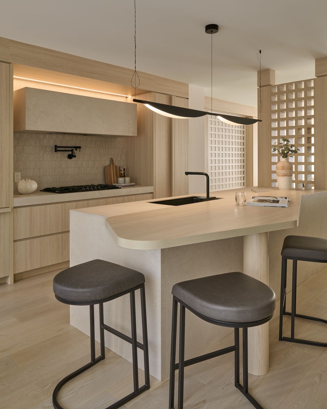 Kitchen with cove lighting, lights on — The Void — interior design by RZ Interiors
