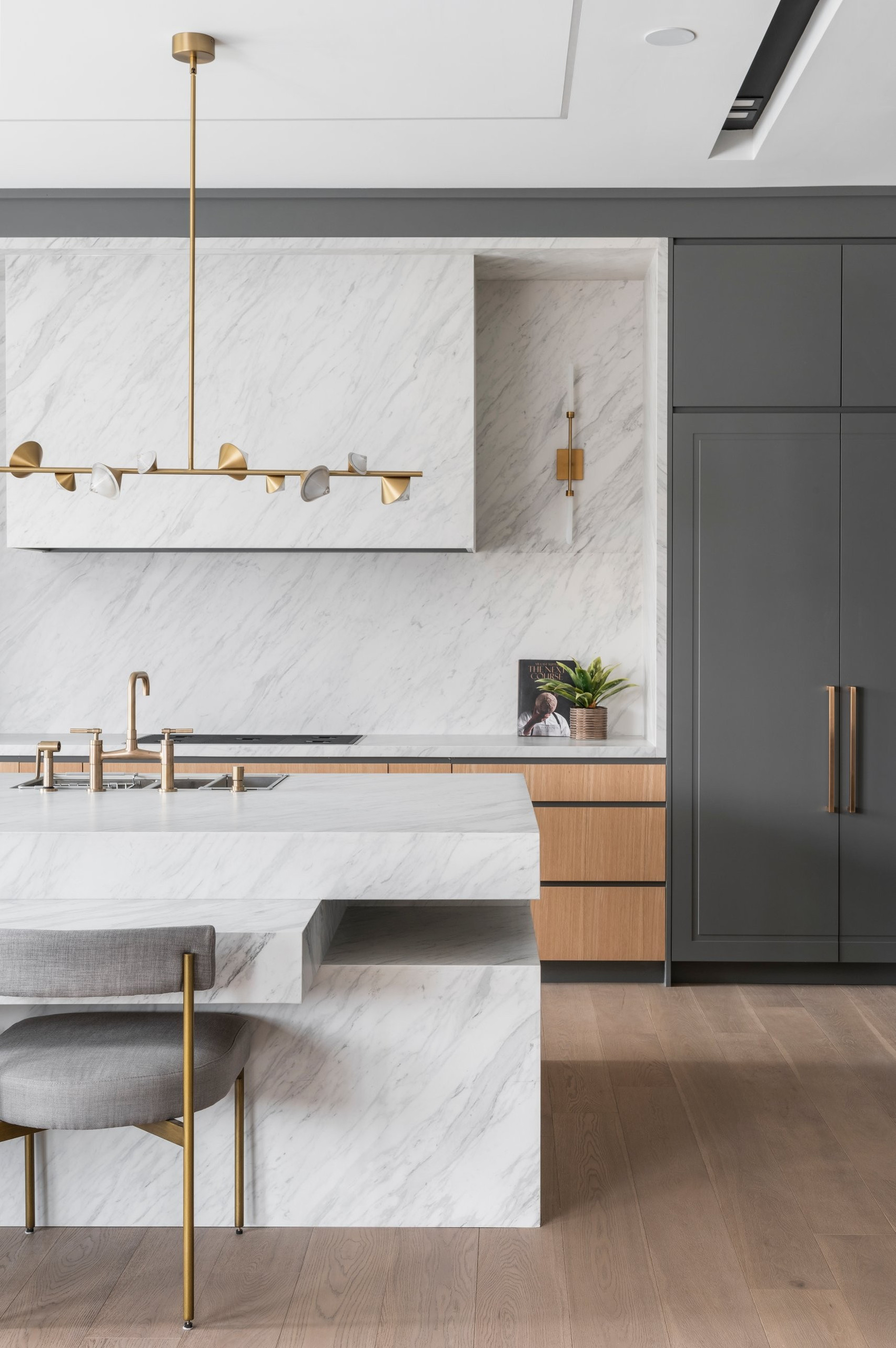 Marble hood and island — Two Volumes, North York, Toronto — interior design by RZ Interiors