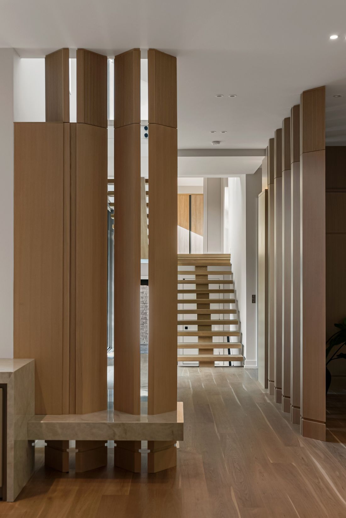 The stair beyond the screens — The Offset, Toronto — interior design by RZ Interiors