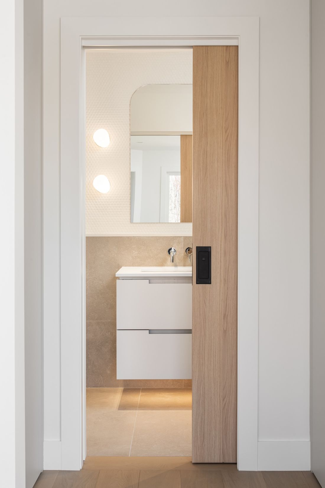 Through the pocket door — The Frame, Kleinburg, Vaughan — interior design by RZ Interiors